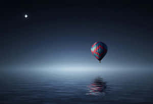 Moonlit Balloon Reflection Night Sky Wallpaper