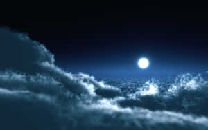 Moonlit_ Night_ Sky_with_ Clouds Wallpaper