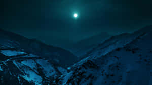 Moonlit_ Snowy_ Mountain_ Pass Wallpaper