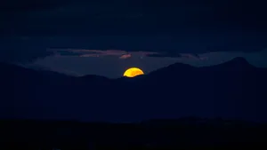 Moonset Over A Serene Lake Wallpaper