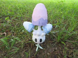 Morelull Figure On Green Grass Wallpaper