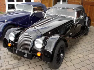 Morgan Sports Car On Scenic Road Wallpaper