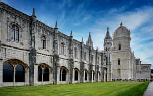 Mosteiro Dos Jeronimos Under Blue Sky Wallpaper