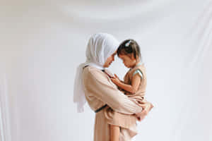 Mother And Daughter Facing Each Other Representing Tangible Love Of A Mother Wallpaper