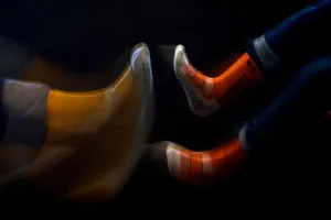 Motion Blurred Socksin Darkness Wallpaper