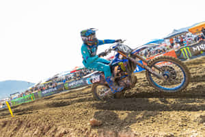 Motocross Racer Cornering Action Wallpaper