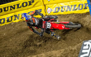 Motocross Racer Cornering Intensely Wallpaper