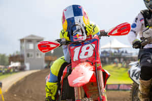 Motocross Racer Number18 Prepares For Race Wallpaper