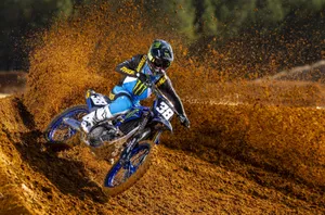 Motocross Rider Corneringin Dirt Wallpaper