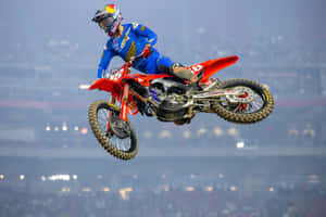 Motocross Rider Midair Jump Wallpaper