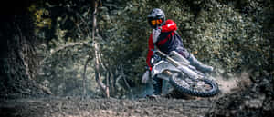 Motocross Riderin Action.jpg Wallpaper