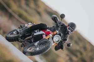 Motorcyclist Leaning Into Turn Wallpaper