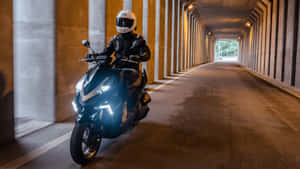 Motorcyclist Speeding Through Tunnel Wallpaper