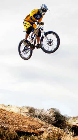 Mountain Biker Midair Jump Wallpaper