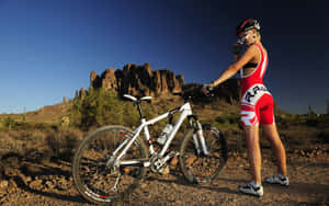 Mountain Biking Adventure Desert Landscape Wallpaper