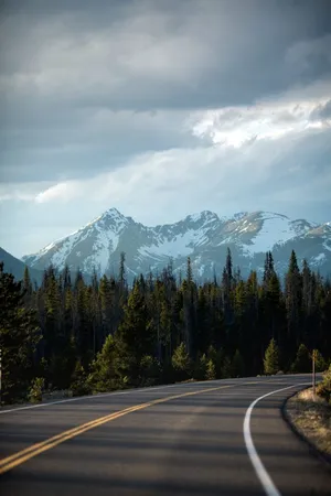 Mountain Road Leadingto Peaks Wallpaper