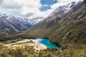 Mountainous Landscapewith Turquoise Lake Wallpaper