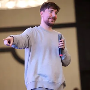 Mr Beast Pointing With Microphone Wallpaper
