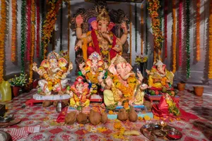 Multiple Vinayaka Statues With Offerings Wallpaper