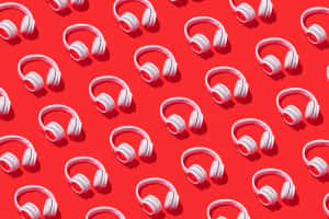 Multiple White Headphoneson Red Background Wallpaper