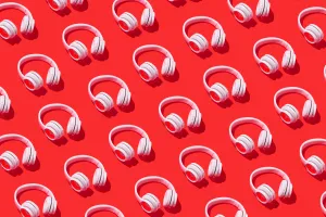 Multiple White Headphoneson Red Background Wallpaper