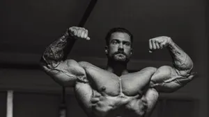 Muscular Man Double Biceps Pose Wallpaper