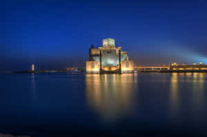 Museum Of Islamic Art Reflected In Evening Ocean Wallpaper