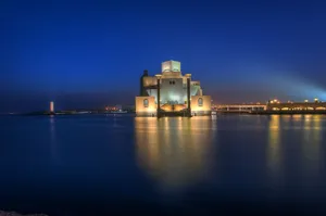 Museum Of Islamic Art Reflected In Evening Ocean Wallpaper