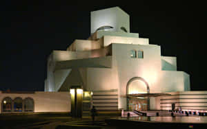 Museum Of Islamic Art With Pitch Black Backdrop Wallpaper