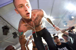 Music Artist Mgk Performing Onstage Wallpaper