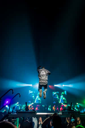 Music Legend Juice Wrld Performing A Passionate Concert Wallpaper