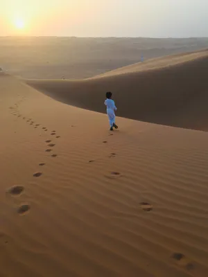 Muslim Boy In The Desert Wallpaper