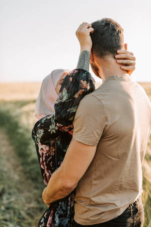 Muslim Couple In A Field Wallpaper