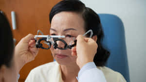 Myopic Adult During A Test Wallpaper