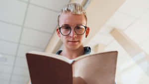 Myopic Person Reading A Book Wallpaper