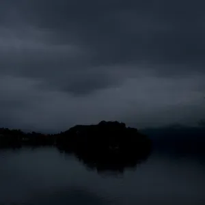 Mysterious Dark Island On A Foggy Night Wallpaper