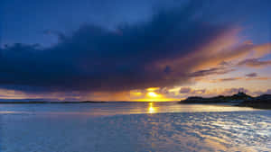 Mysterious Dark Island Under A Stormy Sky Wallpaper