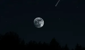 Mysterious Dark Moon Illuminating The Sky Wallpaper