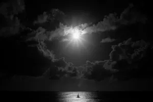 Mysterious Dark Moon Over A Calm Lake Wallpaper