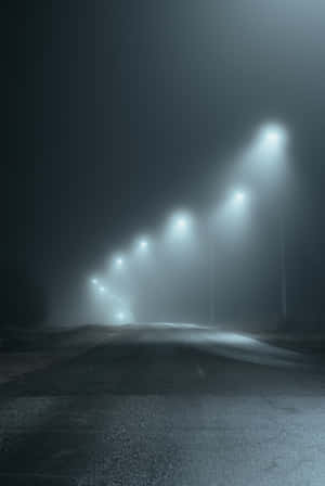 Mysterious Dark Road At Night Wallpaper