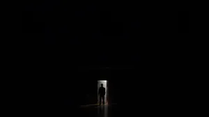 Mysterious Dark Room With A Single Light Source Wallpaper