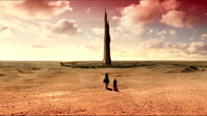 Mysterious Dark Tower Amidst Fiery Sky Wallpaper