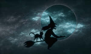 Mysterious Dark Witch With Glowing Eyes And Raven Wallpaper