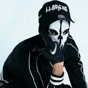 Mysterious_ Figure_in_ Skull_ Mask_and_ Cap Wallpaper