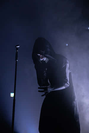 Mysterious_ Figure_in_ Smoke_on_ Stage.jpg Wallpaper