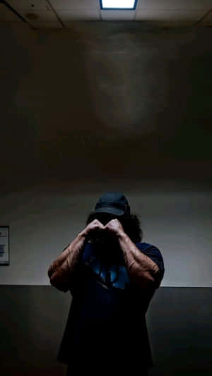 Mysterious Figure Under Light Wallpaper