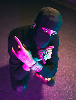 Mysterious_ Figure_ Under_ Purple_ Light Wallpaper