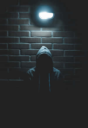 Mysterious Figure Under Streetlight Wallpaper