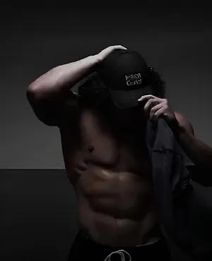 Mysterious Fitness Modelwith Cap Wallpaper