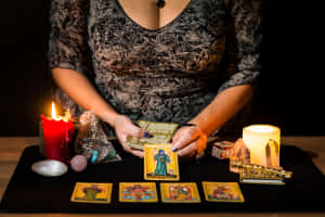 Mysterious Fortune Teller In Her Enchanting Room Wallpaper